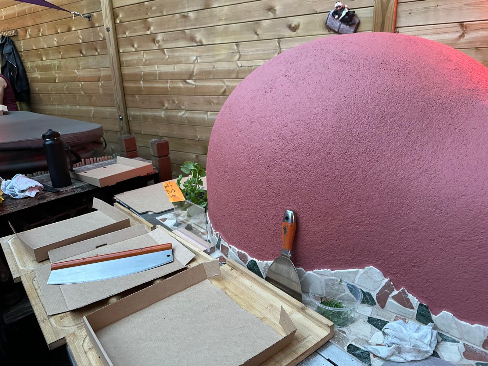 Oven setup with pizza boxes ready for service
